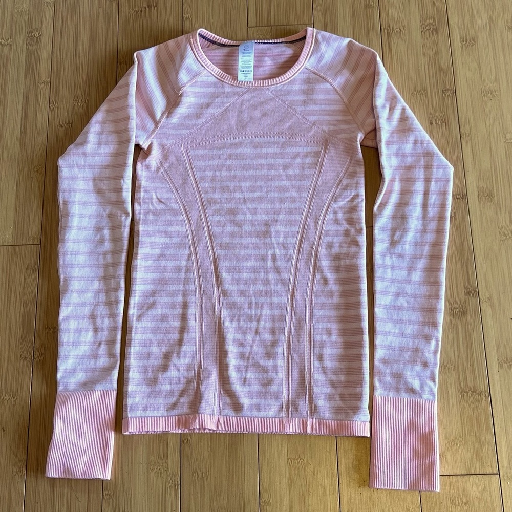 Ivivva size small light coral colored long sleeve girls shirt with thumb holes